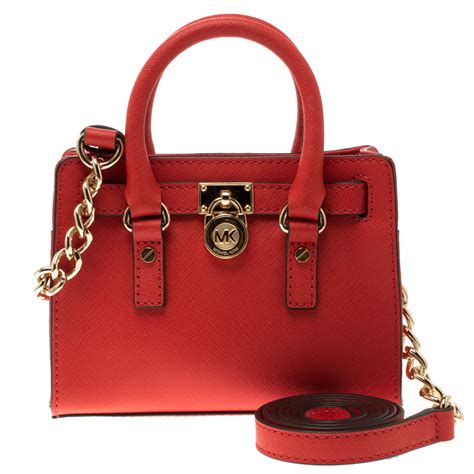 michael kors handbags red used.